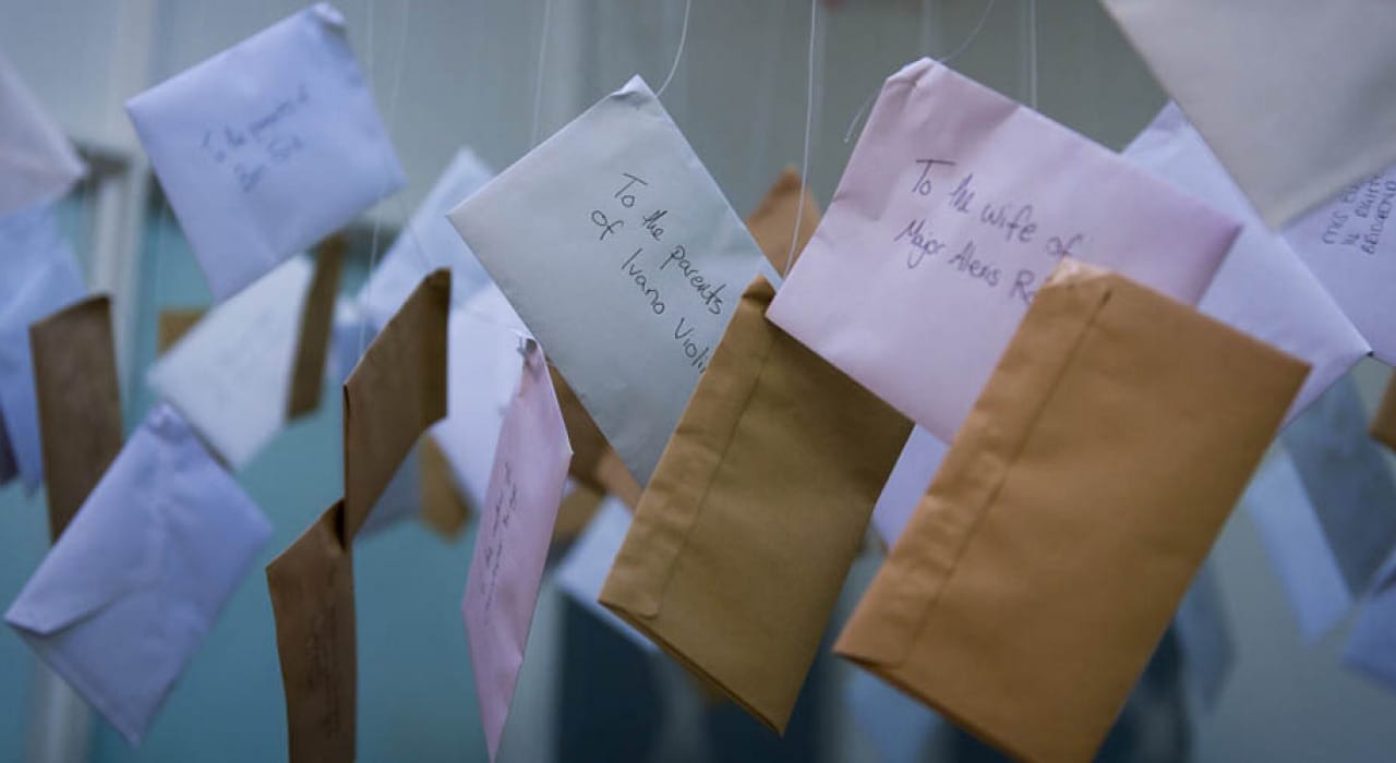 Envelopes suspended from the ceiling on wire