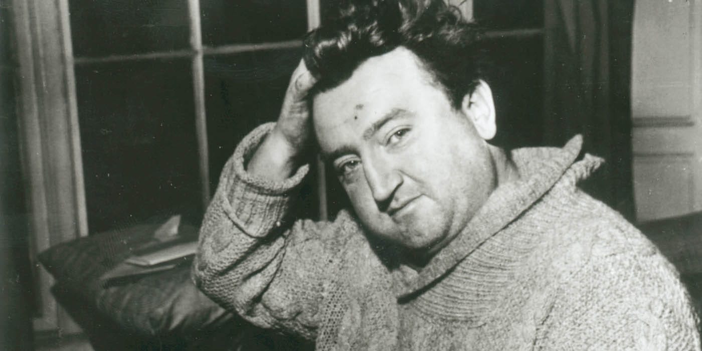 A man leaning on a side with his hand propping up his head